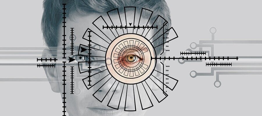 What is biometric authentication? Biometric authentication is done showing circular and linear measuring lines around a man's eye.