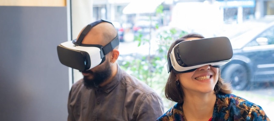 AR AI synergy enjoyed by a man and woman wearing goggles.