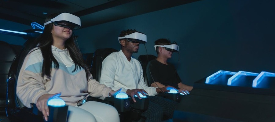 Three people immersed in an augmented reality experience.